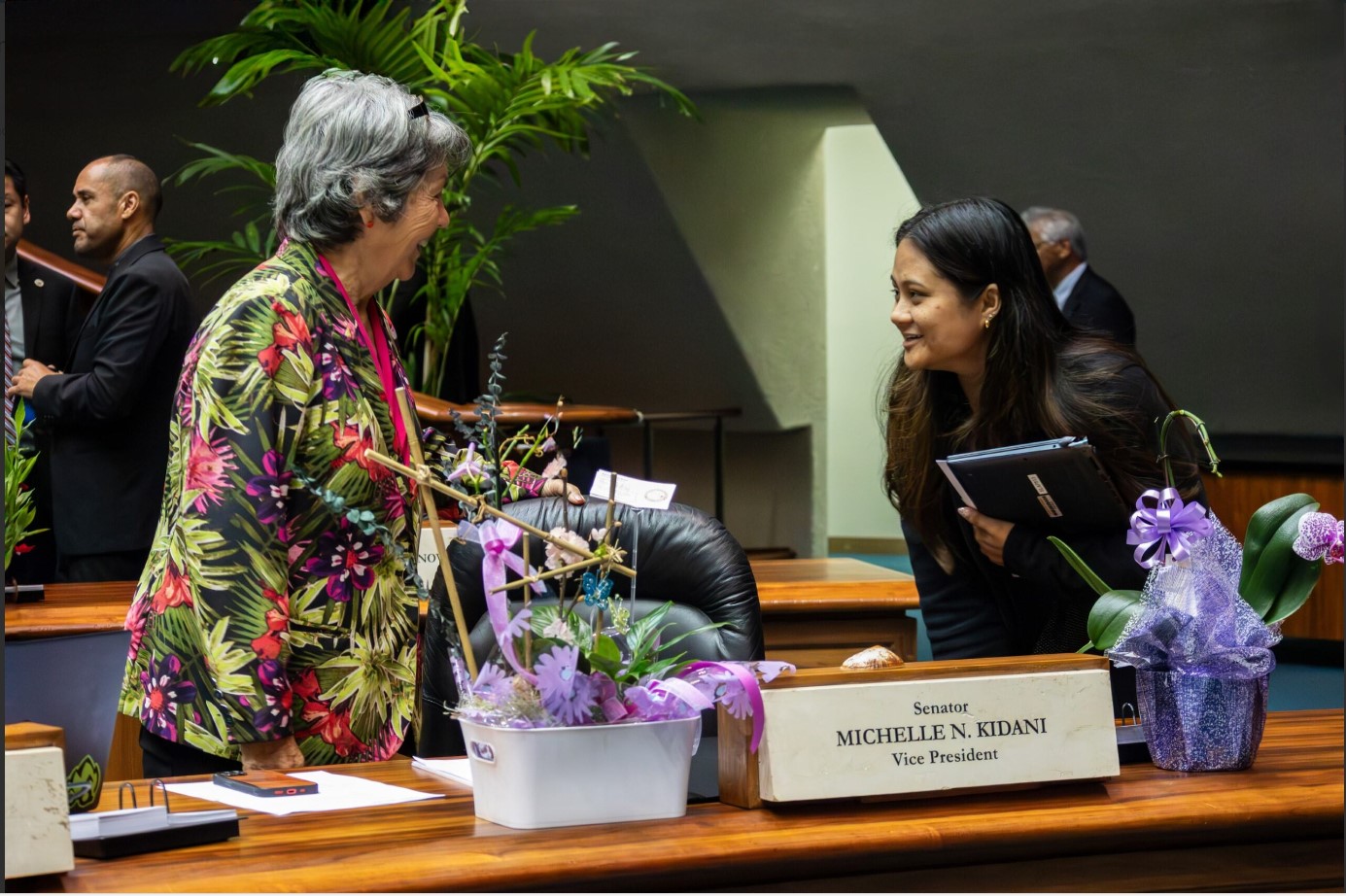 Image of senators talking to one another on senate chamber floor